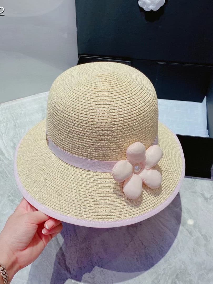 Chanel Women's Straw Hat with Flower Accent