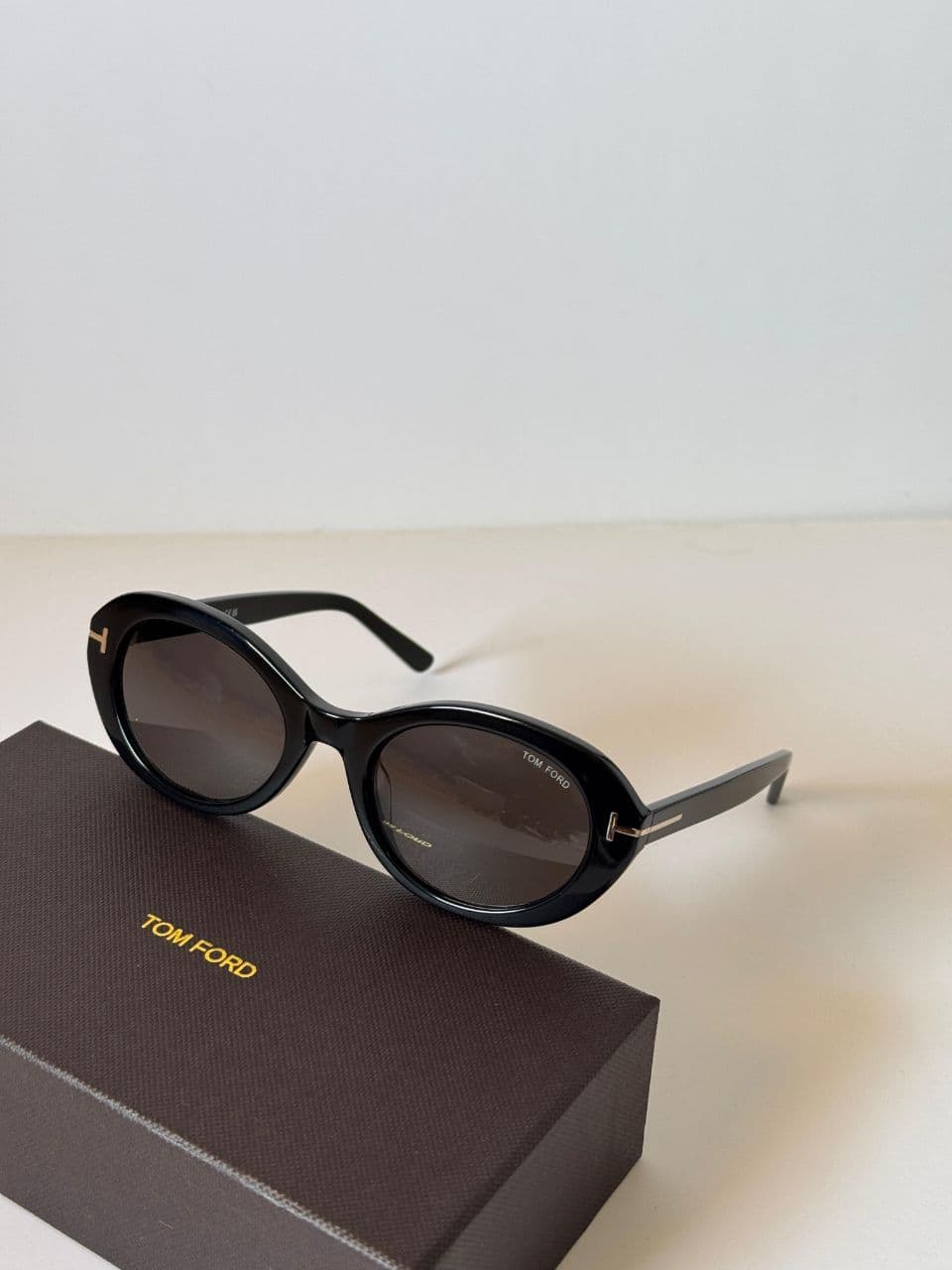 Tom Ford Oval Frame Sunglasses with Signature T-Temple Design