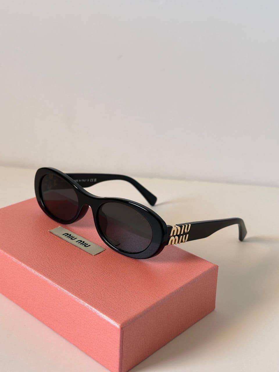 Miu Miu Oval Frame Logo Sunglasses