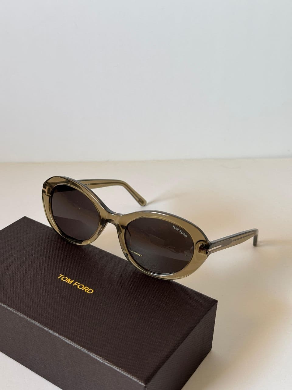 Tom Ford Oval Frame Sunglasses with Signature T-Temple Design