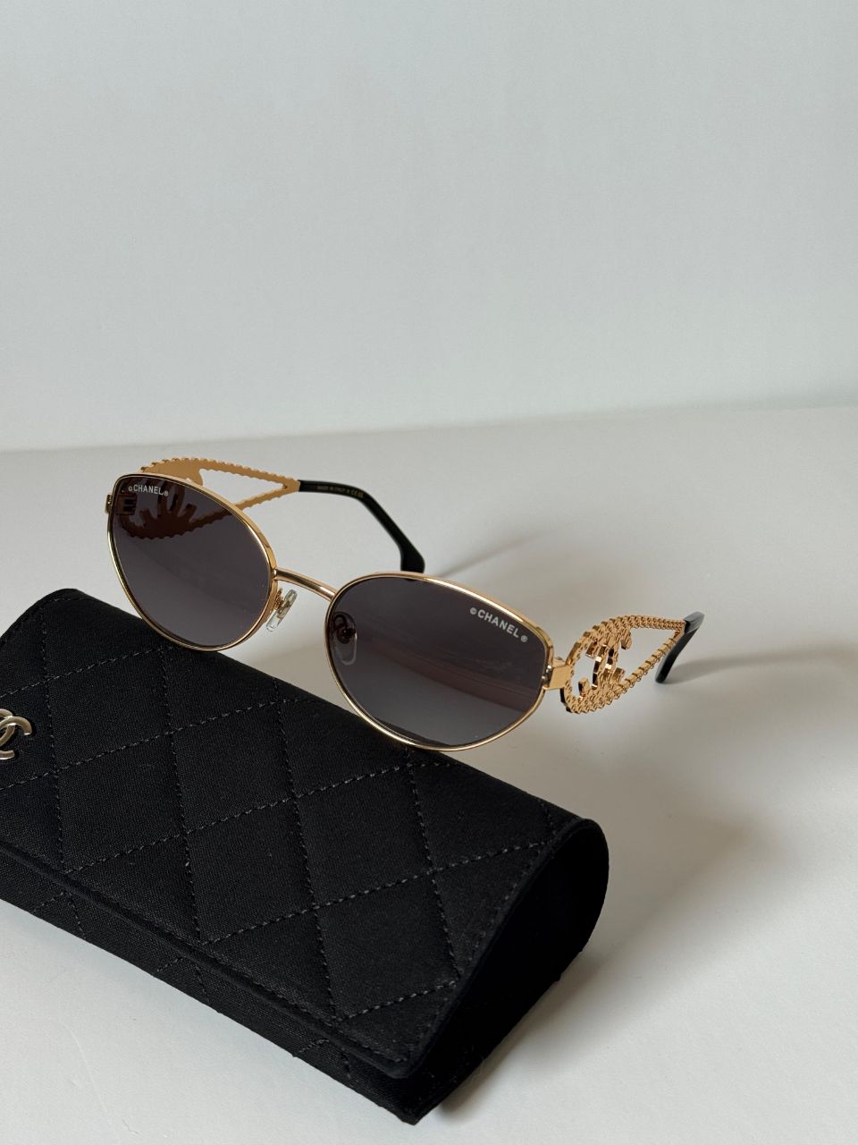 CHANEL Oval Sunglasses with Iconic CC Chain Temple Design