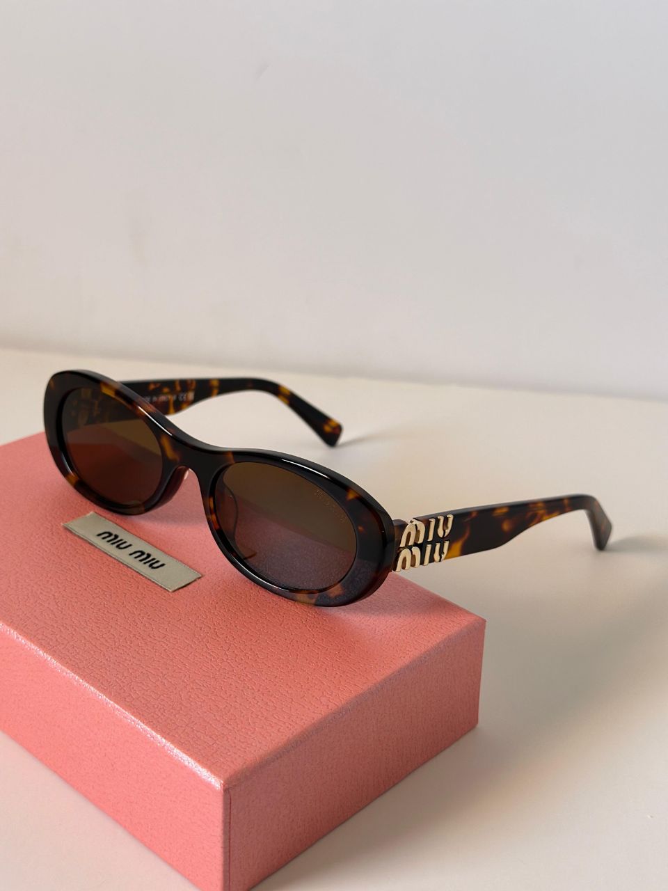 Miu Miu Oval Frame Logo Sunglasses