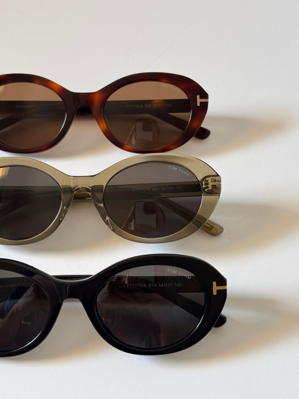 Tom Ford Oval Frame Sunglasses with Signature T-Temple Design