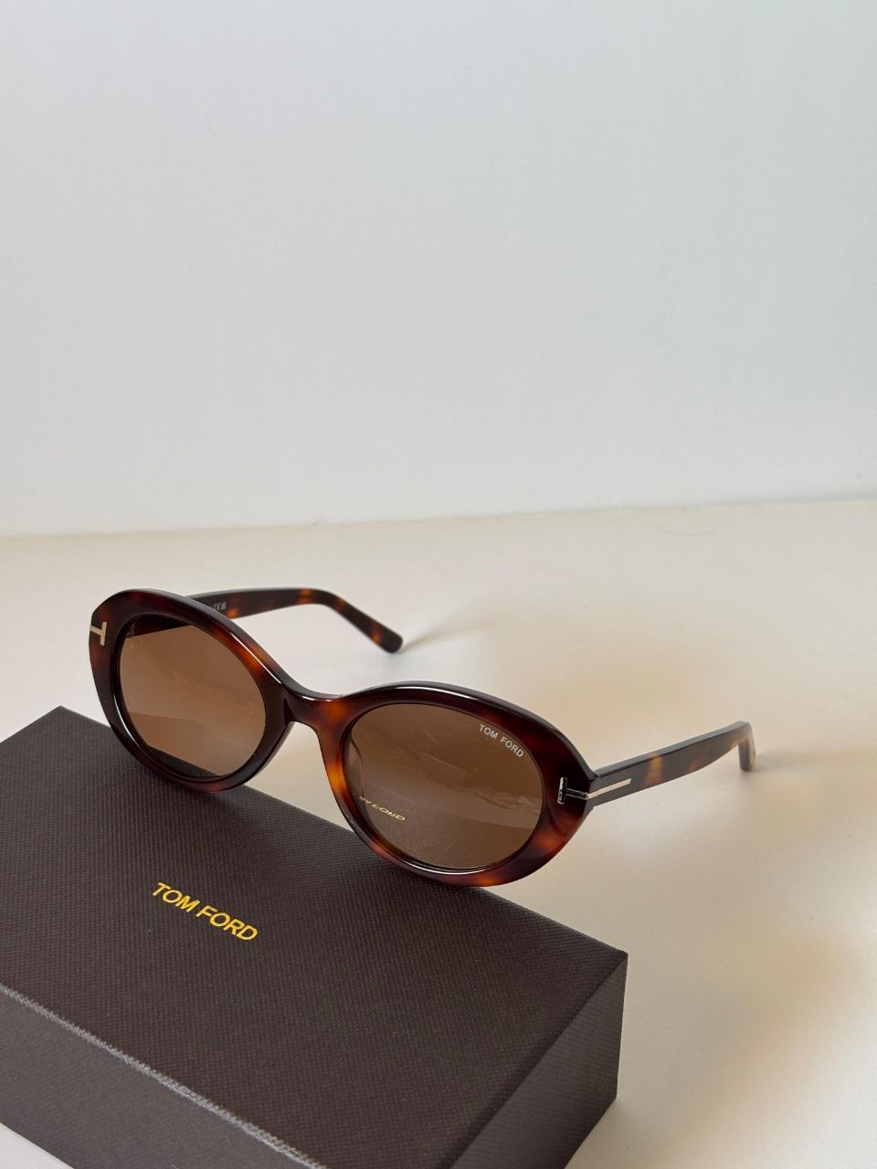 Tom Ford Oval Frame Sunglasses with Signature T-Temple Design