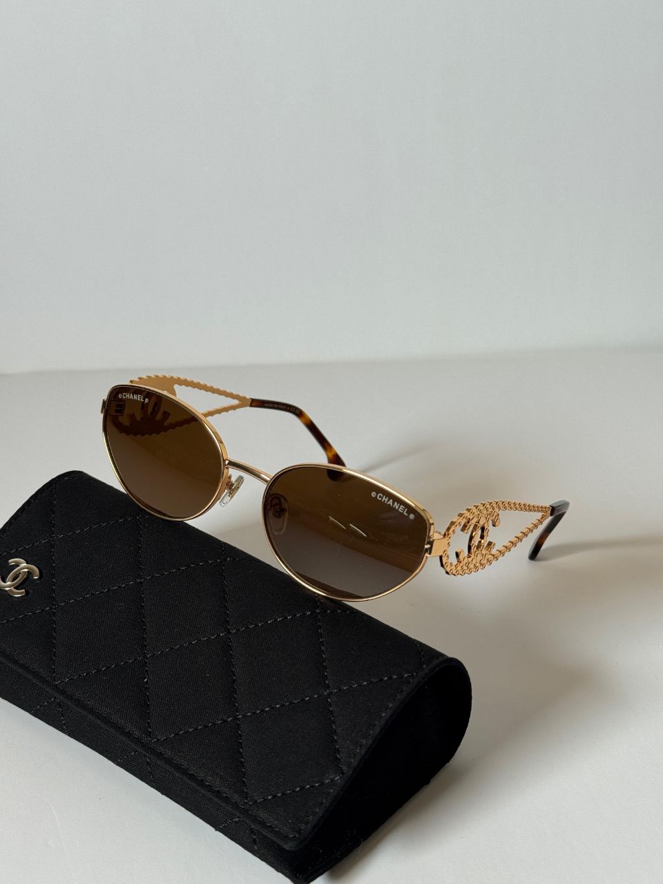 CHANEL Oval Sunglasses with Iconic CC Chain Temple Design