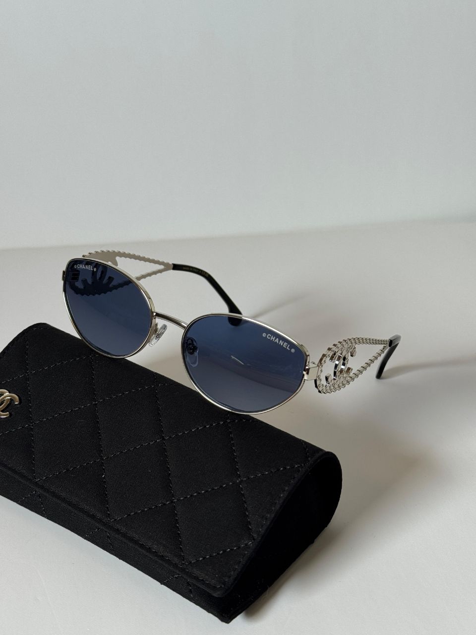 CHANEL Oval Sunglasses with Iconic CC Chain Temple Design